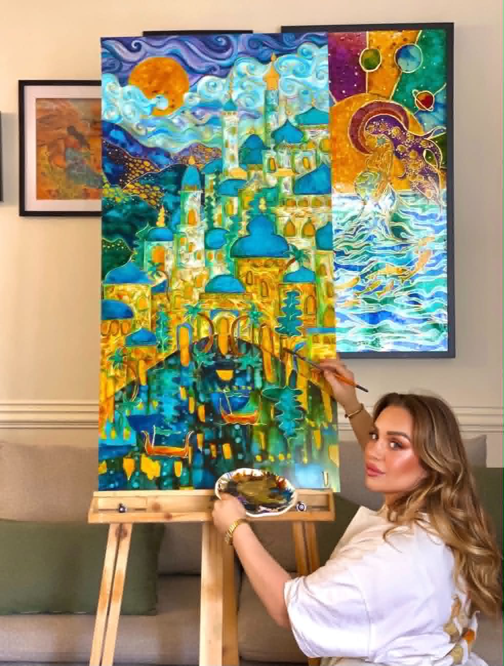 Caroline painting in her studio